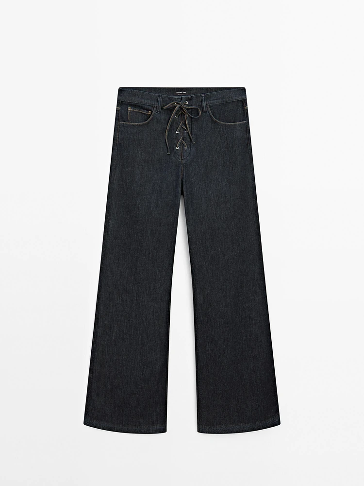 Flared jeans with tie detail