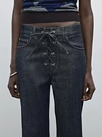 Flared jeans with tie detail