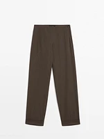 Suit trousers with turn-up hems