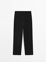 Trousers with buttoned hems