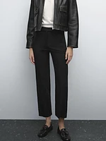 Trousers with buttoned hems