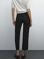 Trousers with buttoned hems