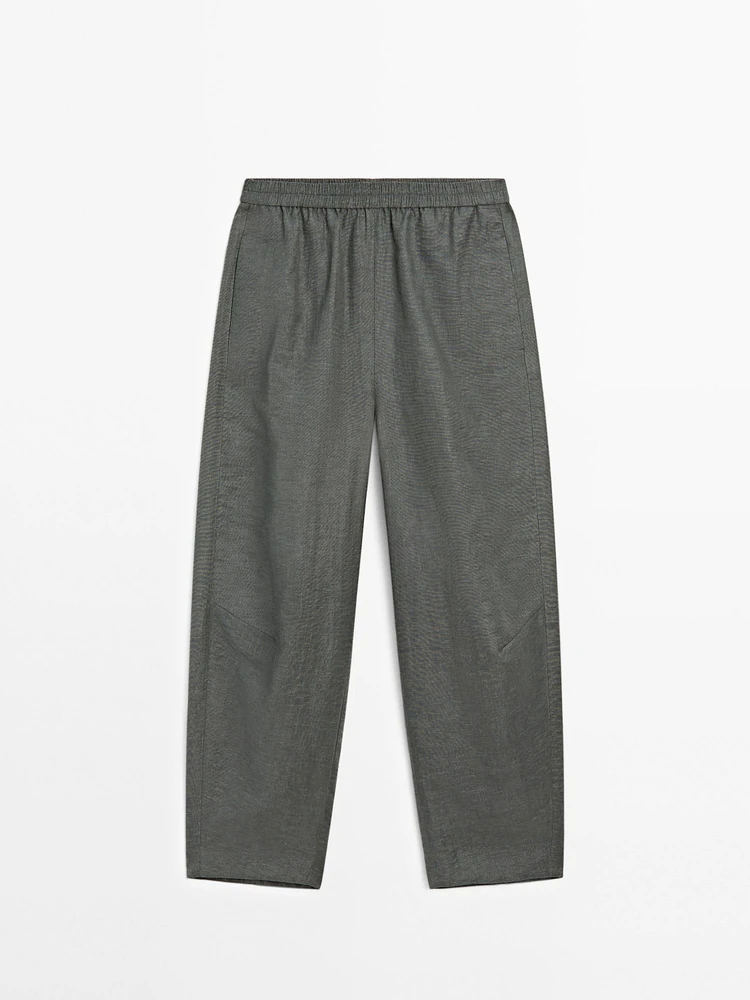 Suit trousers with elasticated waistband