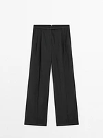 Pleated pinstripe trousers