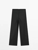 Pleated pinstripe trousers