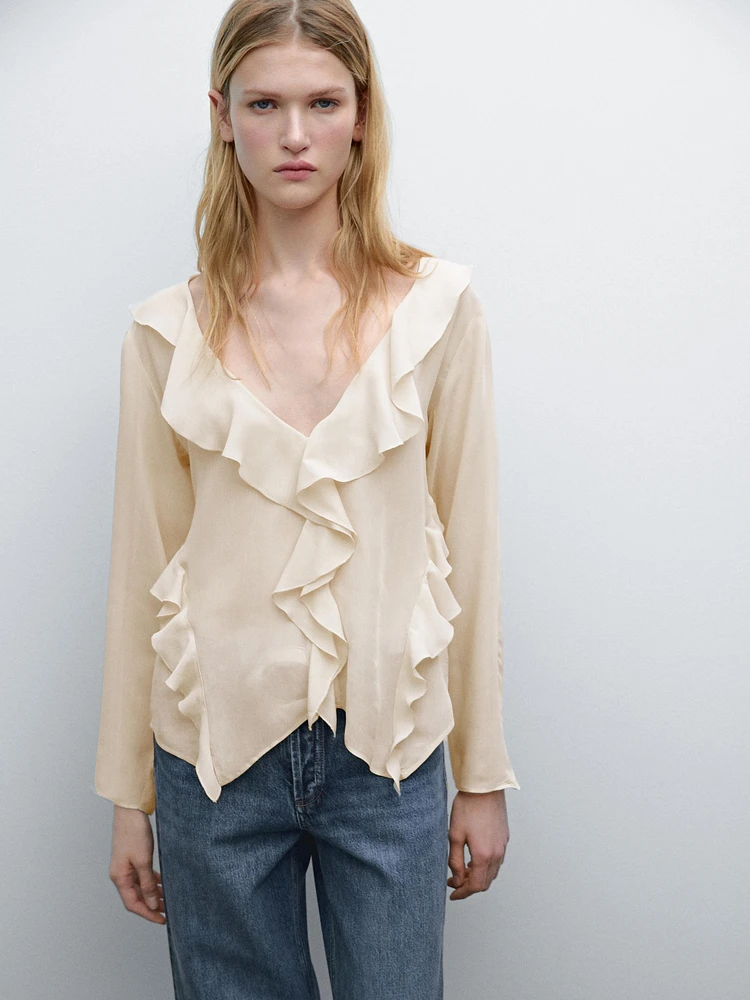 Ruffled shirt with asymmetric hem