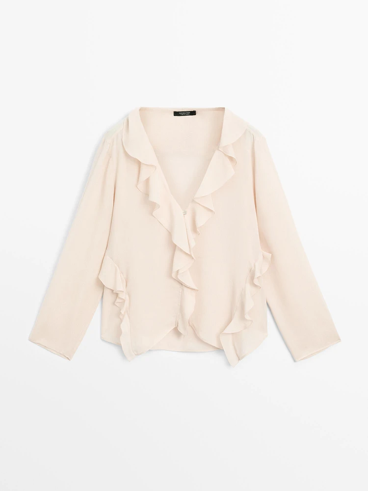 Ruffled shirt with asymmetric hem