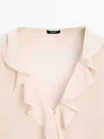 Ruffled shirt with asymmetric hem