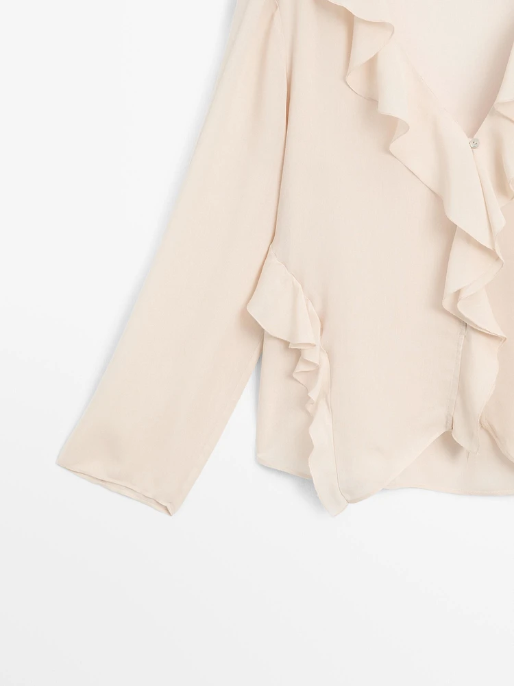 Ruffled shirt with asymmetric hem