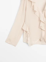 Ruffled shirt with asymmetric hem