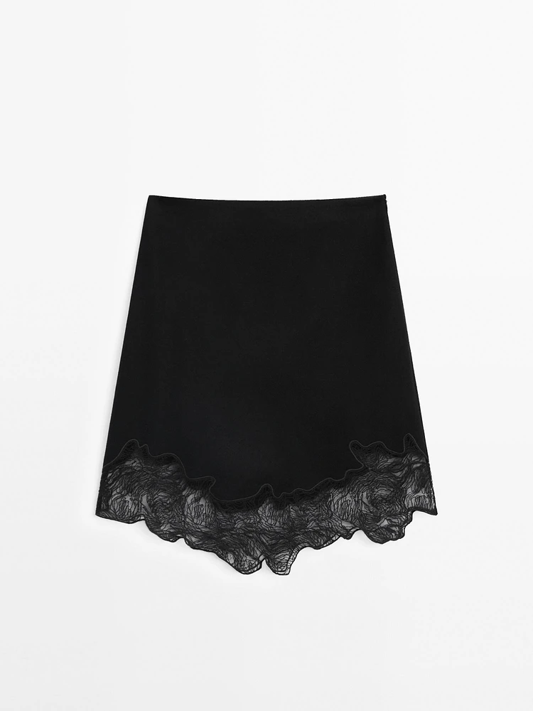 Short asymmetric lace-trimmed skirt