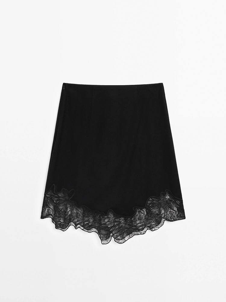 Short asymmetric lace-trimmed skirt