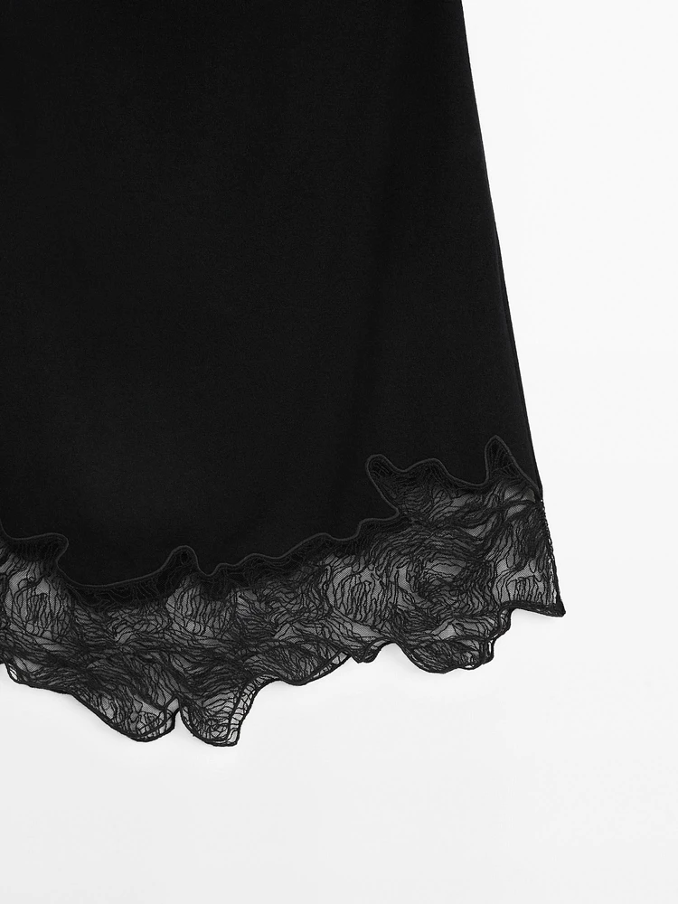 Short asymmetric lace-trimmed skirt