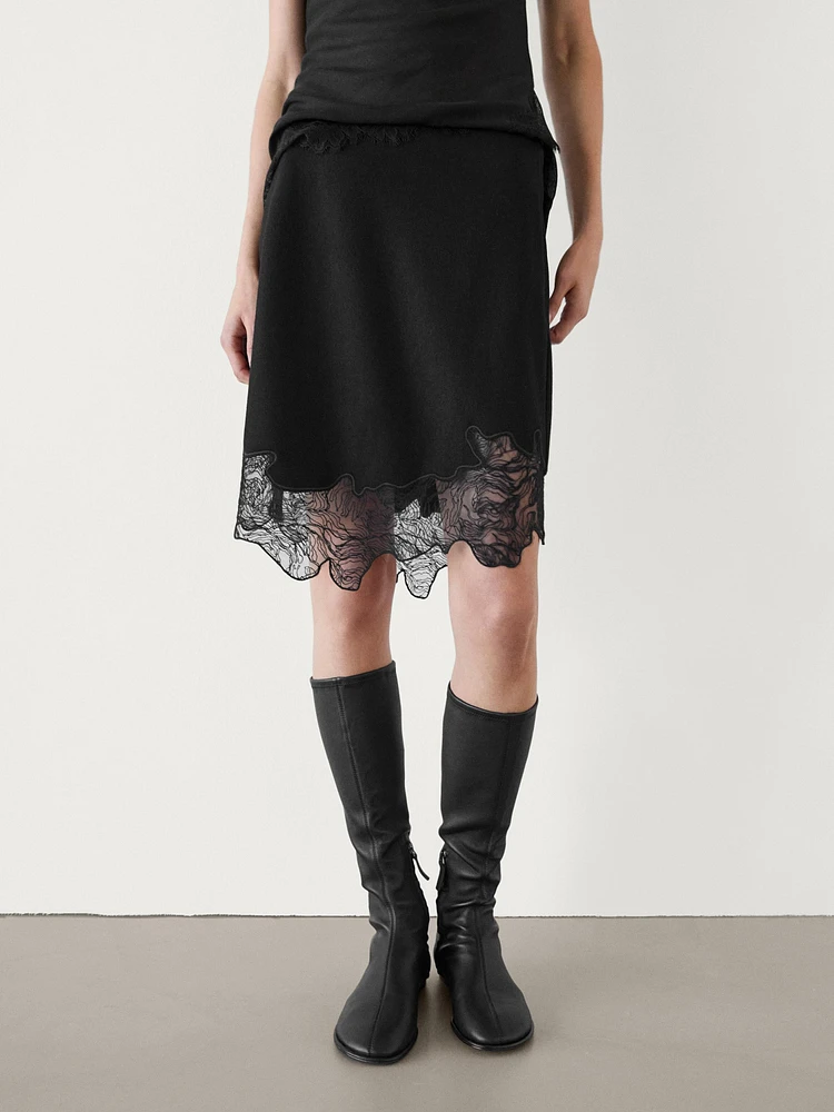 Short asymmetric lace-trimmed skirt