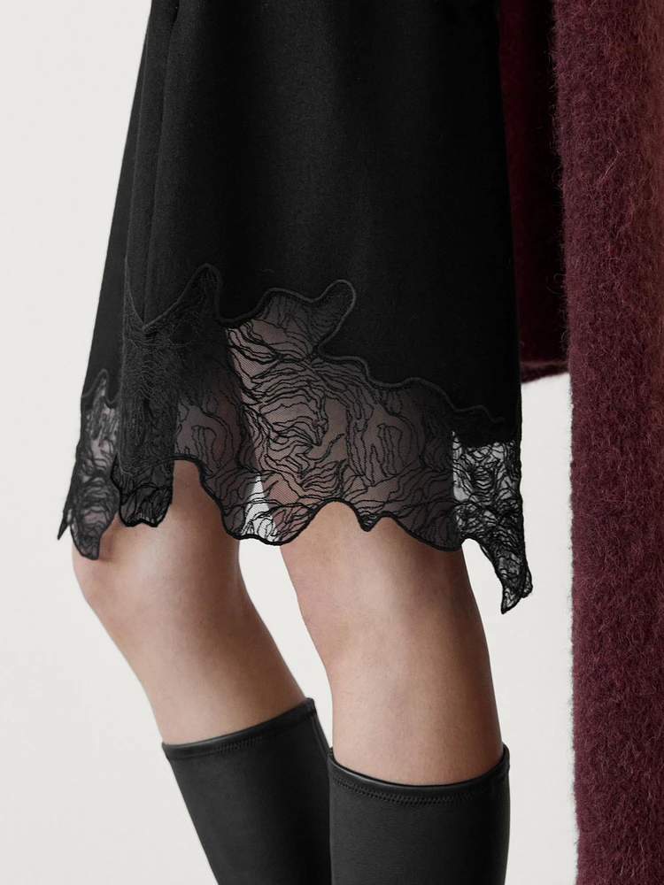 Short asymmetric lace-trimmed skirt