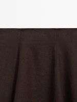 Flared linen skirt with hem detail