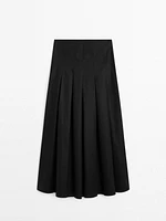 Midi skirt with asymmetric pleats