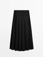 Midi skirt with asymmetric pleats