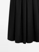 Midi skirt with asymmetric pleats