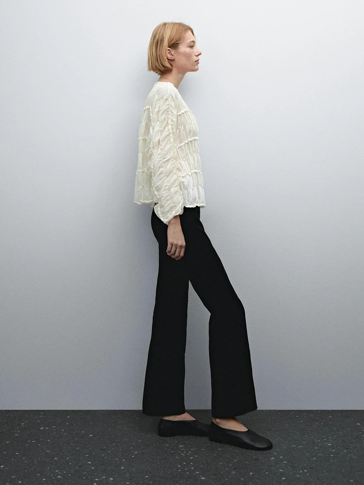 Pantalon flare stretch en cuir et daim