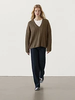 Cable-knit V-neck sweater