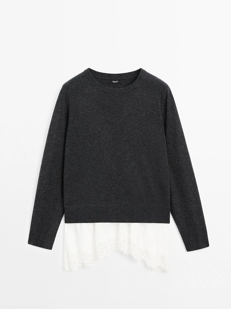 Knit sweater with lace trim on the hem