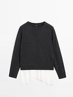 Knit sweater with lace trim on the hem