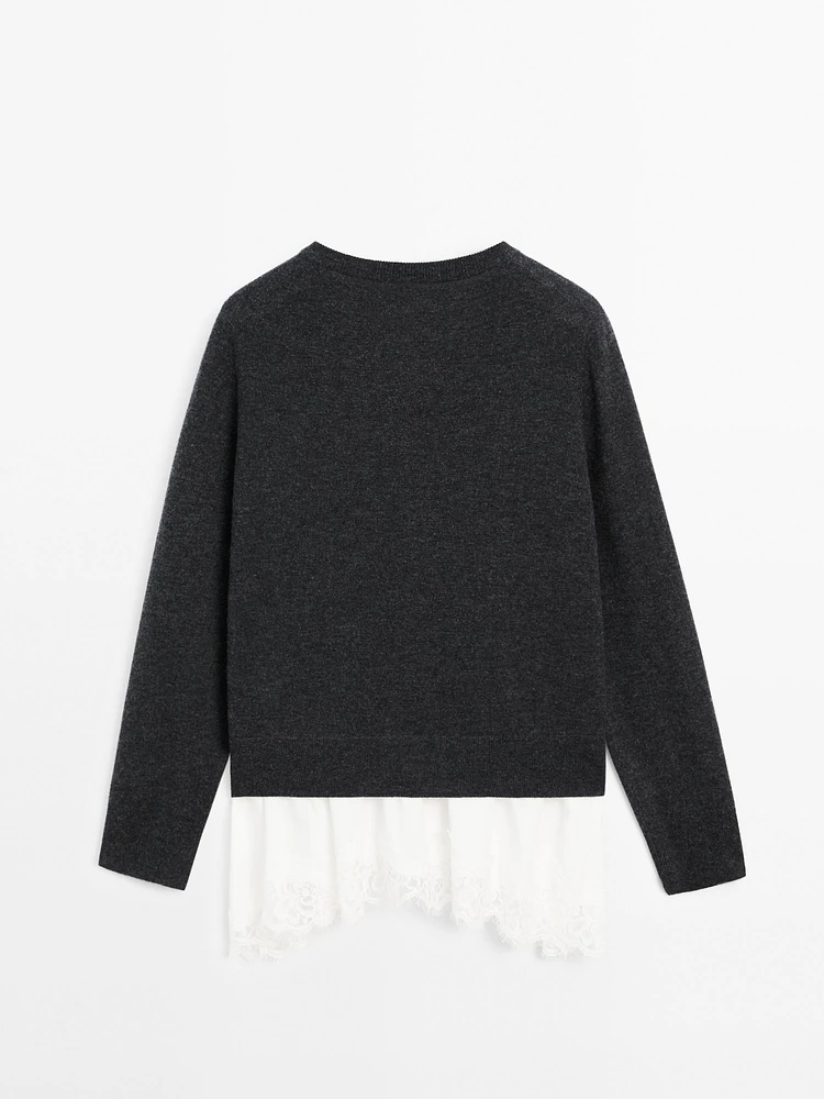 Knit sweater with lace trim on the hem