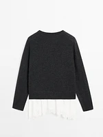 Knit sweater with lace trim on the hem