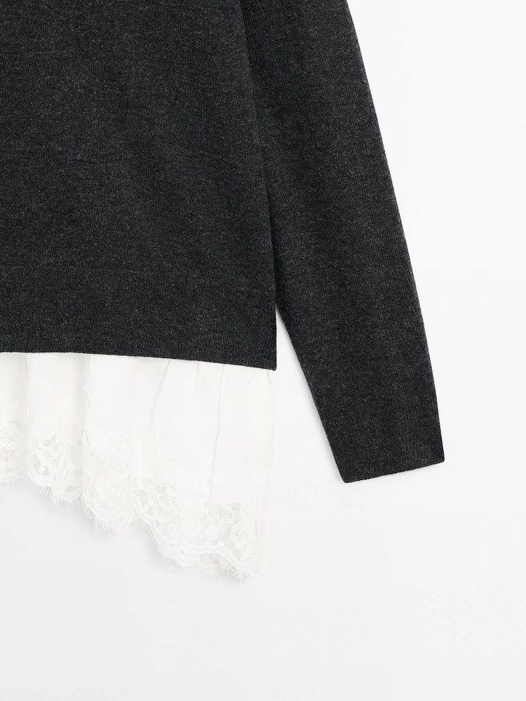 Knit sweater with lace trim on the hem