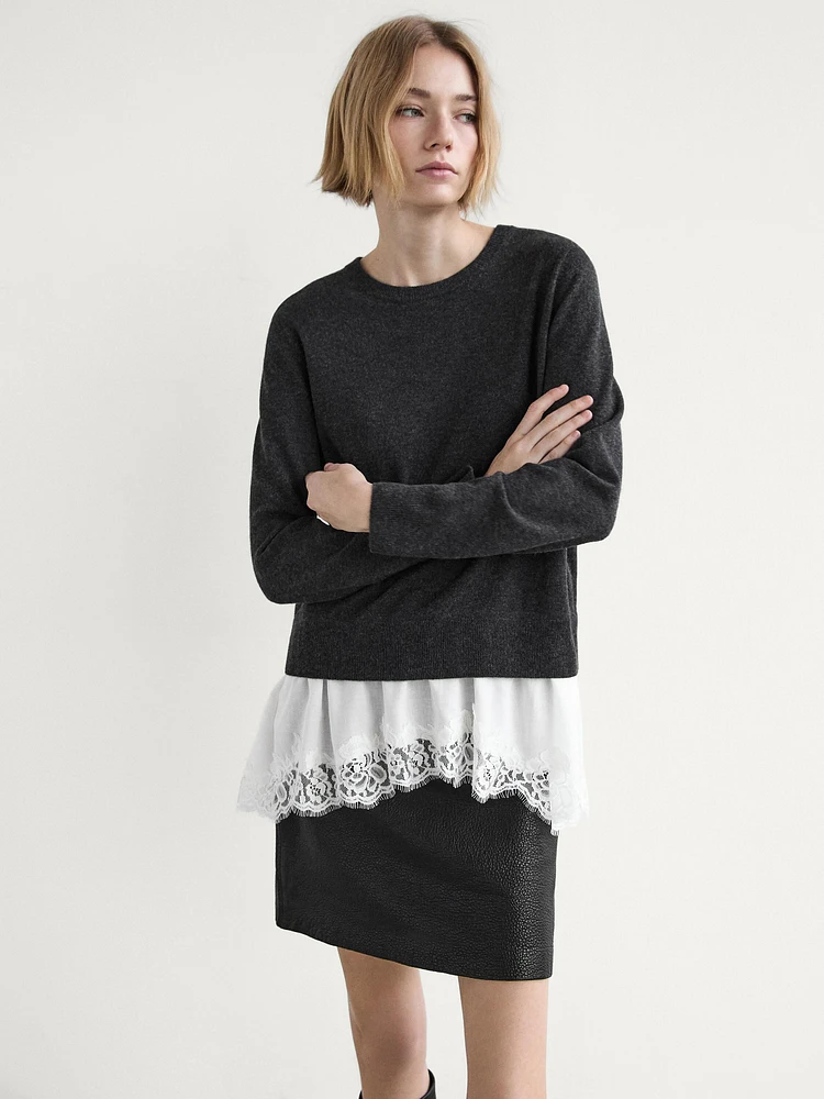 Knit sweater with lace trim on the hem