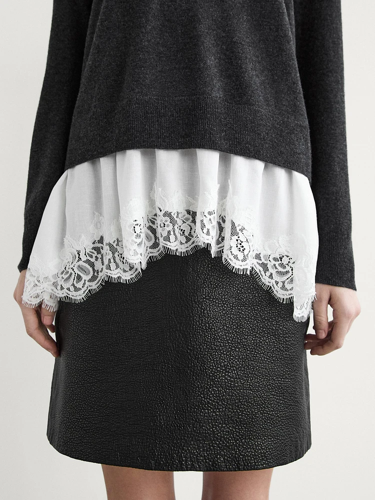 Knit sweater with lace trim on the hem