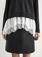 Knit sweater with lace trim on the hem