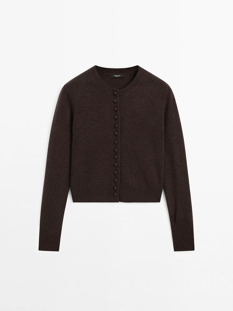 Short knit cardigan with covered buttons