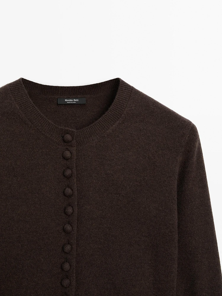 Short knit cardigan with covered buttons