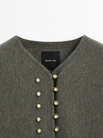 Jacket with ball button fastening