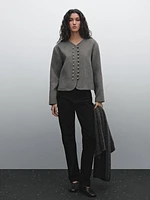 Jacket with ball button fastening