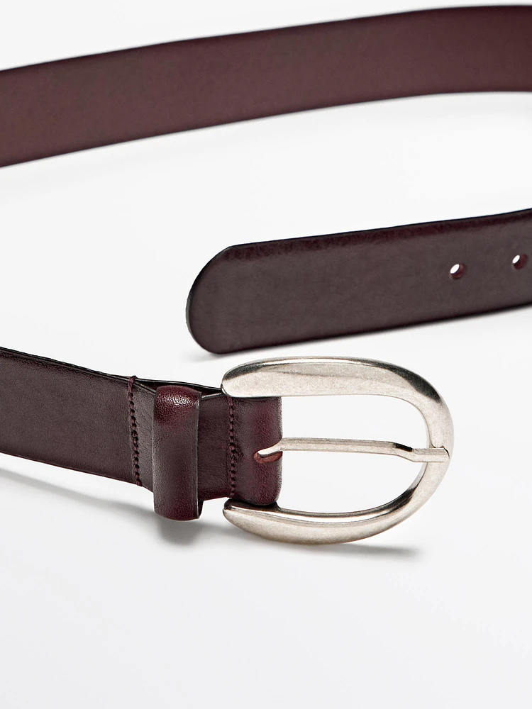 Leather belt with oval buckle