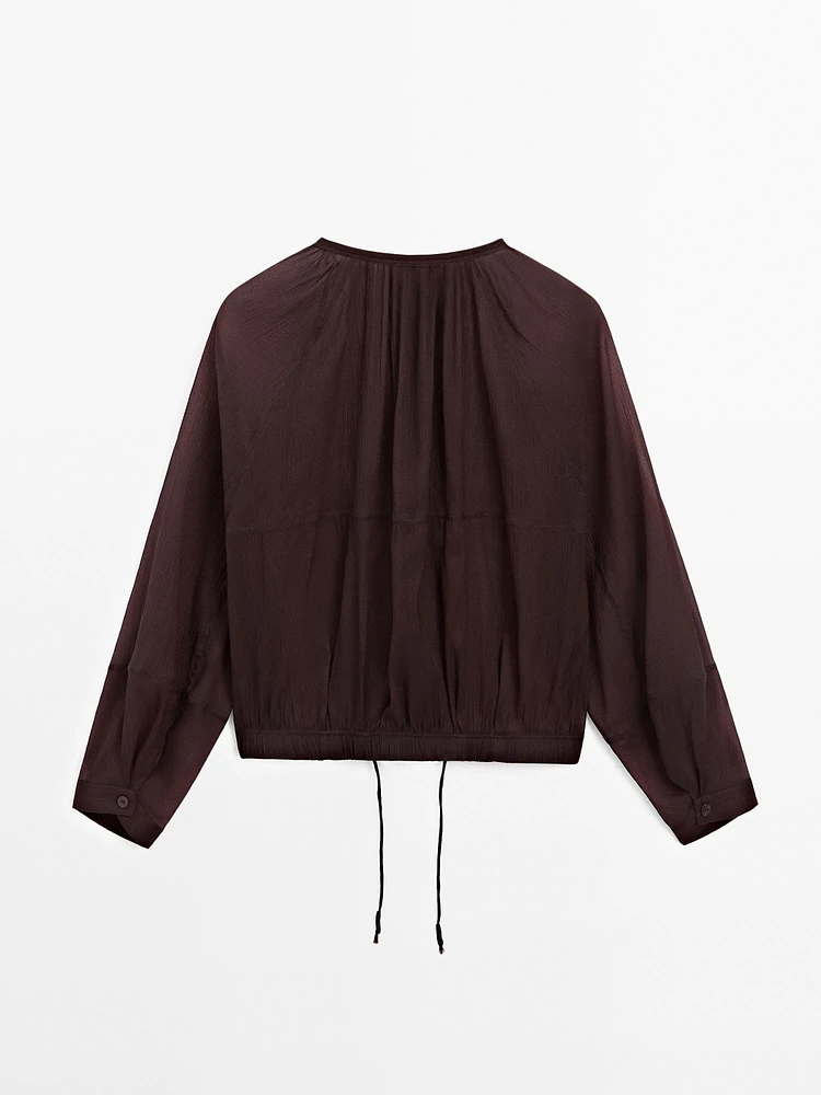 Flowing semi-sheer bomber jacket