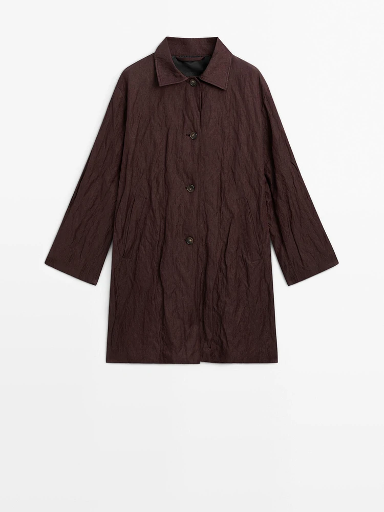 Creased-effect trench coat