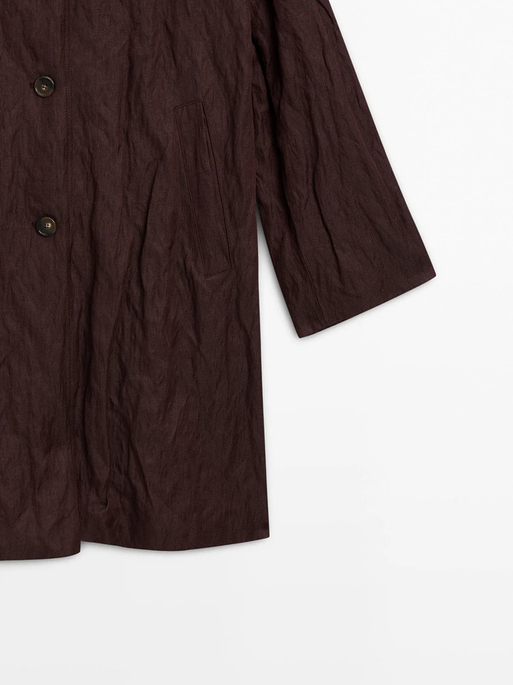 Creased-effect trench coat