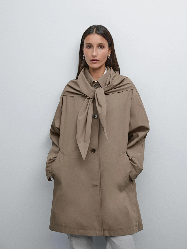 Trench coat with detachable scarf detail