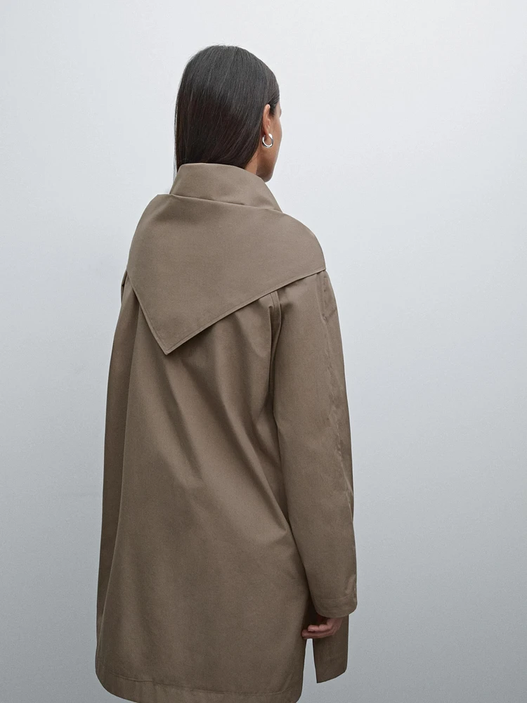 Trench coat with detachable scarf detail