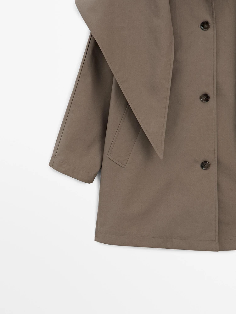 Trench coat with detachable scarf detail