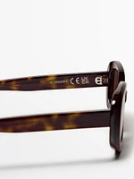 Oval tortoiseshell-effect sunglasses