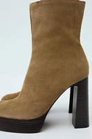 SUEDE PLATFORM HEELED ANKLE BOOTS