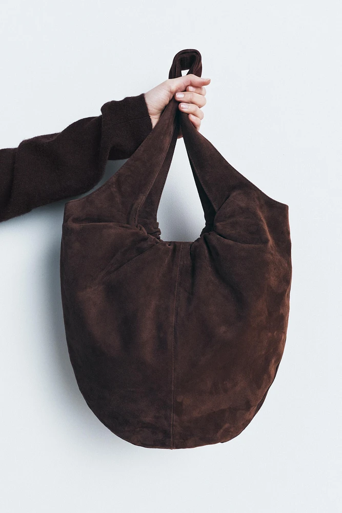 RUCHED SPLIT LEATHER BUCKET BAG