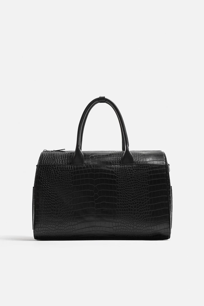 EMBOSSED TRAVEL BAG