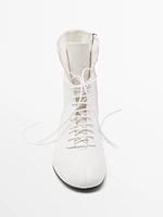 Lace-up flat ankle boots