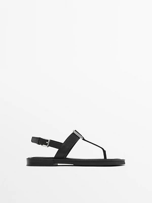 Sandals with metal piece